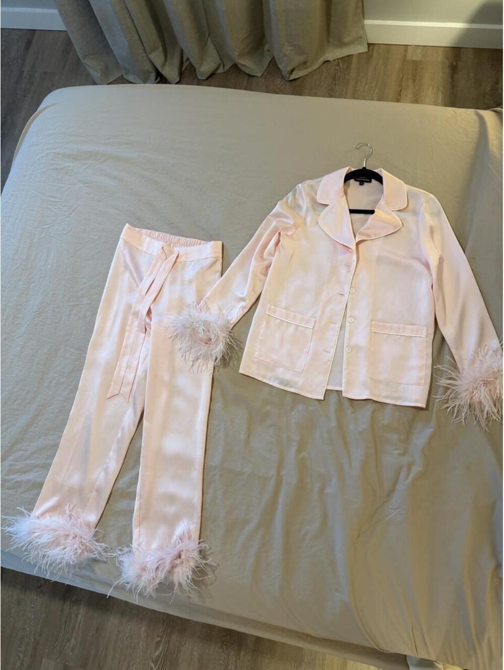 Nadine Merabi pink satin feathered suit